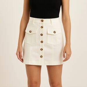 Lucy Paris Button Front Mini SkirtSize small Color: lvory Buttoned flap pockets.